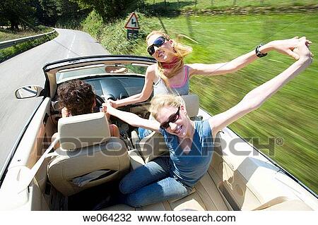 Stock Image - amusement, blurred motion, automobile, Arms open, 20's. Fotosearch