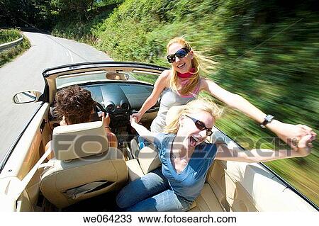 Stock Image - amusement, blurred motion, automobile, Arms open, 20's. Fotosearch