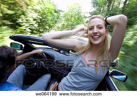 Stock Photo - amusement, blurred motion, automobile, Arms raised, 20's. Fotosearch