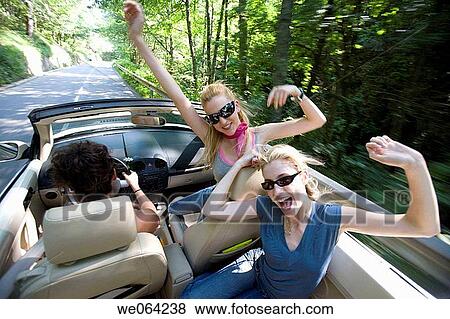 Stock Photo - amusement, blurred motion, automobile, Arms raised, 20's. Fotosearch