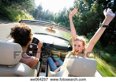 Stock Photo - amusement, blurred motion, automobile, Arms raised, 20's. Fotosearch