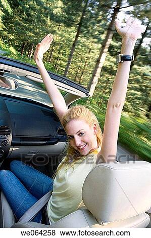 Stock Photo - amusement, blurred motion, automobile, Arms raised, 20's. Fotosearch