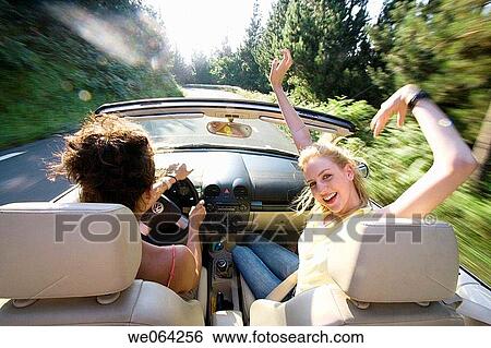 Stock Photograph - amusement, blurred motion, automobile, Arms raised, 20's. Fotosearch