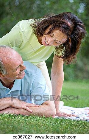 Stock Photo - amusement, bond, blanket, baby boomer, affection. Fotosearch