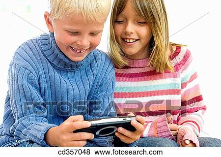 amusement, brother, boy, blond, addiction View Large Photo Image Stock Photo - amusement, brother, boy, blond, addiction. Fotosearch
