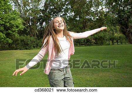 amusement, carefree, Arms open, adolescence View Large Photo Image Stock Image - amusement, carefree, Arms open, adolescence. Fotosearch