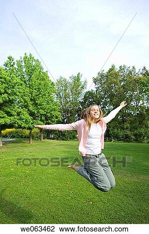 amusement, carefree, barefoot, Arms open, adolescence View Large Photo Image Stock Image - amusement, carefree, barefoot, Arms open, adolescence. Fotosearch
