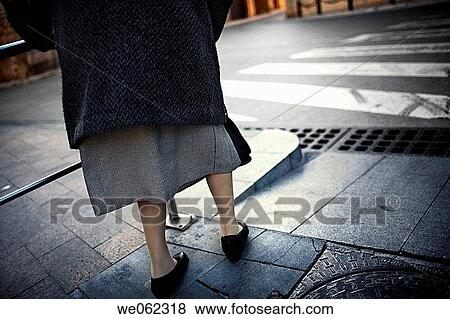 Stock Photo - anonymous, city, bannister, back view, aged. Fotosearch
