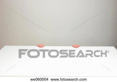Anonymous office worker hiding under an empty desk. View Large Photo Image Picture - Anonymous office worker hiding under an empty desk.. Fotosearch