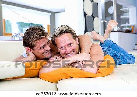 Stock Image - apartment, bond, barefoot, at-home, affection. Fotosearch