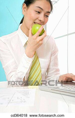 apple, biting, bite, Asian, 20's View Large Photo Image Stock Photo - apple, biting, bite, Asian, 20's. Fotosearch