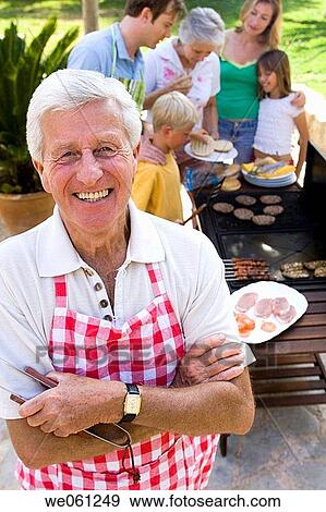 Stock Photo - apron, arms folded, Arms crossed, 3 generations. Fotosearch