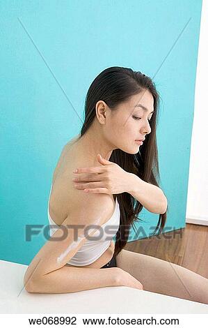 Stock Image - arm, Beauty Care, beauty, Asian, apply. Fotosearch