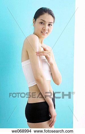 arm, Body care, Asian, apply View Large Photo Image Picture - arm, Body care, Asian, apply. Fotosearch