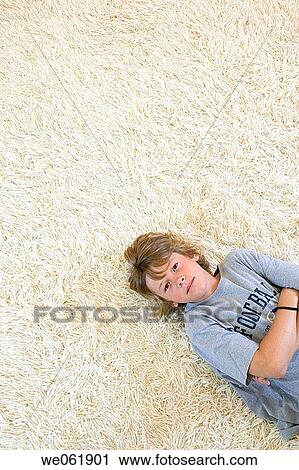 Stock Image - arms folded, carpet, boy, Arms crossed. Fotosearch