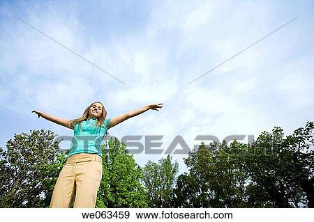 Arms open, cloud, carefree, adolescence View Large Photo Image Stock Photo - Arms open, cloud, carefree, adolescence. Fotosearch