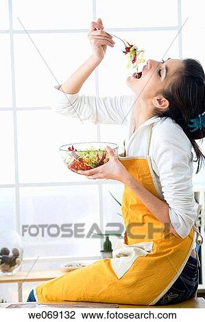 Arms raised, brunette, bowl, at-home, apron View Large Photo Image Stock Image - Arms raised, brunette, bowl, at-home, apron. Fotosearch