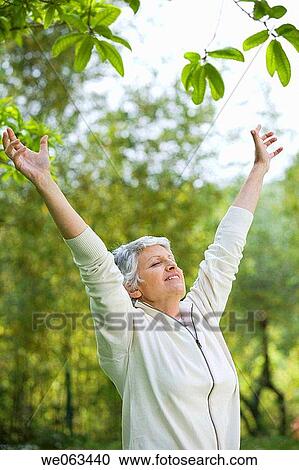 Arms raised, calm, Arms open View Large Photo Image Stock Image - Arms raised, calm, Arms open. Fotosearch
