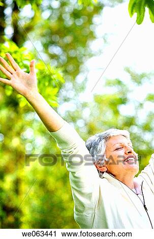 Arms raised, calm, Arms open View Large Photo Image Stock Image - Arms raised, calm, Arms open. Fotosearch