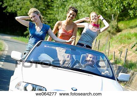Arms raised, car, automobile, amusement View Large Photo Image Stock Photo - Arms raised, car, automobile, amusement. Fotosearch