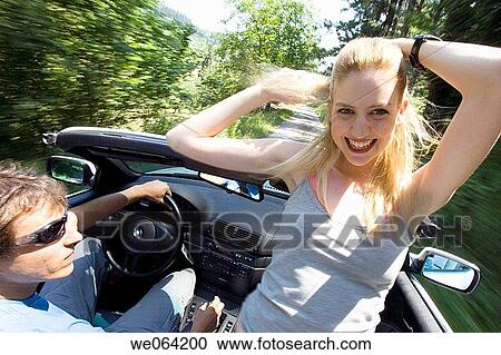 Arms raised, carefree, car, automobile, amusement View Large Photo Image Stock Image - Arms raised, carefree, car, automobile, amusement. Fotosearch