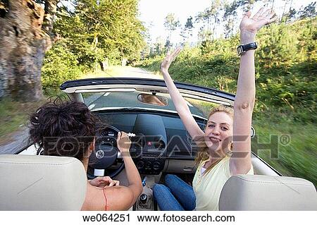 Arms raised, carefree, car, automobile, amusement View Large Photo Image Stock Image - Arms raised, carefree, car, automobile, amusement. Fotosearch