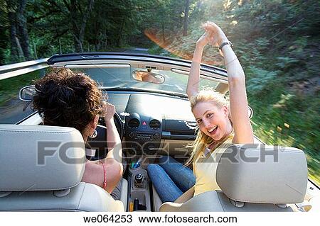 Arms raised, carefree, car, automobile, amusement View Large Photo Image Stock Image - Arms raised, carefree, car, automobile, amusement. Fotosearch