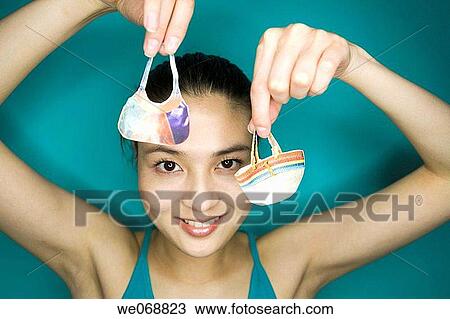 Arms raised, Close-up, bag, Asian, accessory View Large Photo Image Stock Image - Arms raised, Close-up, bag, Asian, accessory. Fotosearch