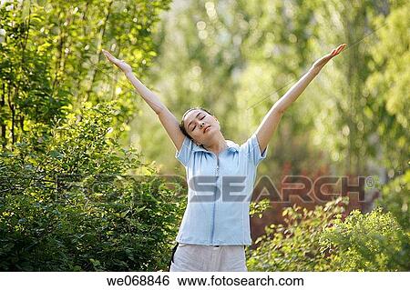 Arms raised, contemporary, Asian, Arms open View Large Photo Image Stock Photograph - Arms raised, contemporary, Asian, Arms open. Fotosearch