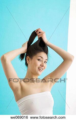 Asian, carnality, Arms raised View Large Photo Image Stock Photograph - Asian, carnality, Arms raised. Fotosearch