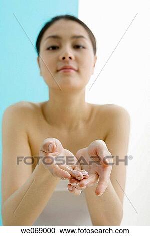 Asian, carnality, Body care, apply View Large Photo Image Stock Image - Asian, carnality, Body care, apply. Fotosearch