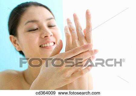 Stock Photo - Asian, Chinese, Body care, apply. Fotosearch