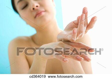 Stock Photo - Asian, Chinese, Body care, apply. Fotosearch