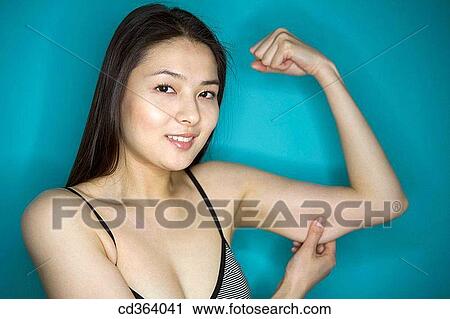 Stock Image - Asian, Chinese, Body care, arm. Fotosearch
