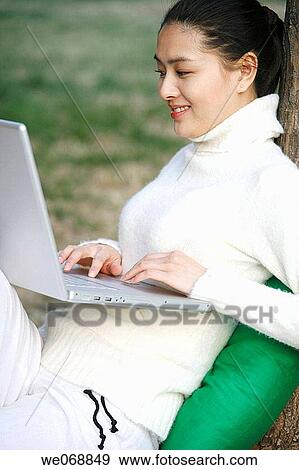 Asian, computer, calm, 20's View Large Photo Image Stock Photo - Asian, computer, calm, 20's. Fotosearch