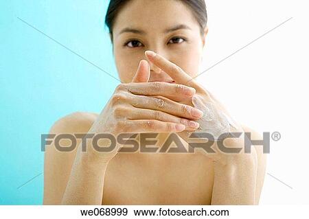 Asian, contemporary, Body care, apply View Large Photo Image Stock Photo - Asian, contemporary, Body care, apply. Fotosearch