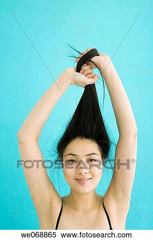 Asian, ethnic, contemporary, Arms raised View Large Photo Image Stock Photography - Asian, ethnic, contemporary, Arms raised. Fotosearch