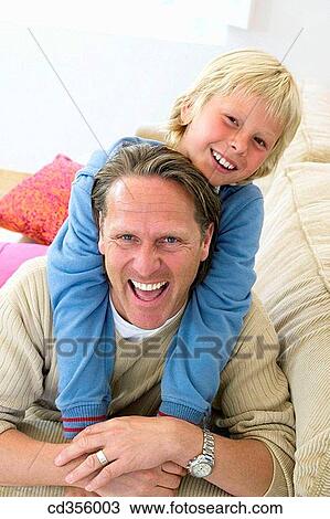at-home, boy, bonding, bond, affection View Large Photo Image Stock Image - at-home, boy, bonding, bond, affection. Fotosearch