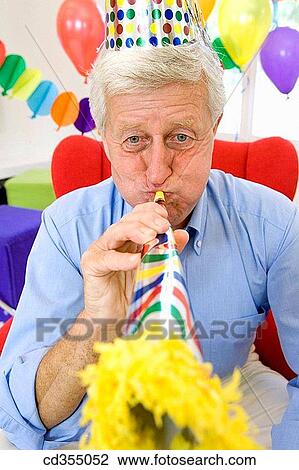 at-home, cap, blowing, blow, amusement View Large Photo Image Stock Image - at-home, cap, blowing, blow, amusement. Fotosearch