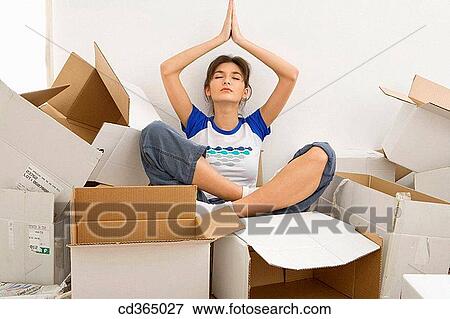 at-home, cardboard, brunette, Arms raised View Large Photo Image Stock Photo - at-home, cardboard, brunette, Arms raised. Fotosearch