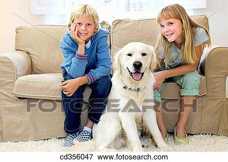 Stock Photo - at-home, child, brother, boy, animal. Fotosearch