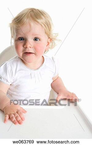 Stock Photo - attentive, blue eyes, blond, baby, attention. Fotosearch