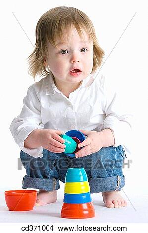 Picture - baby, barefoot, child, childhood. Fotosearch