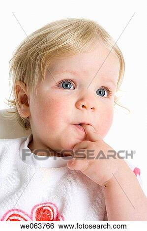 Stock Photograph - baby, bib, blond, blue eyes, child. Fotosearch
