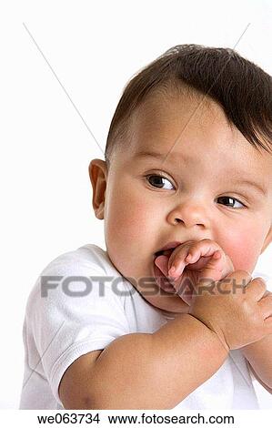 baby, bite, biting, black hair, child View Large Photo Image Picture - baby, bite, biting, black hair, child. Fotosearch