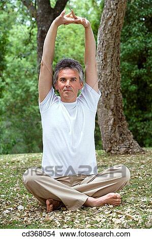 baby boomer, barefoot, Arms raised View Large Photo Image Picture - baby boomer, barefoot, Arms raised. Fotosearch