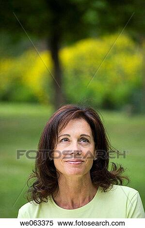 Stock Photography - baby boomer, brunette, absorbed. Fotosearch
