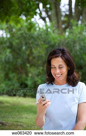 baby boomer, brunette, calling, cell phone View Large Photo Image Stock Image - baby boomer, brunette, calling, cell phone. Fotosearch
