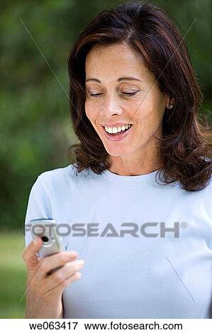 baby boomer, brunette, calling, cell phone View Large Photo Image Stock Photo - baby boomer, brunette, calling, cell phone. Fotosearch