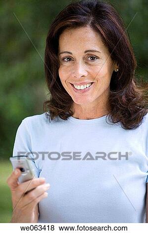 baby boomer, brunette, calling, cell phone View Large Photo Image Stock Photo - baby boomer, brunette, calling, cell phone. Fotosearch